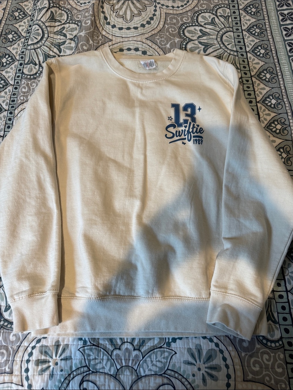 Cream Crewneck Sweatshirt with Blue Chest Logo